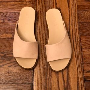Tan leather flip flops